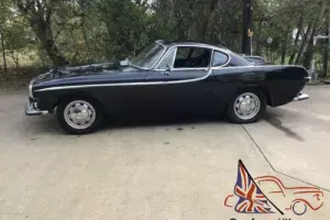 1966 Volvo P1800 red black