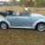 1970 Volkswagen Beetle Convertible.  Bluish silver with a dark blue cloth top.