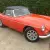  MG B Roadster...blaze orange..superb bodywork with leather interior. Overdrive. 