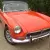  MG B Roadster...blaze orange..superb bodywork with leather interior. Overdrive. 
