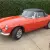  MG B Roadster...blaze orange..superb bodywork with leather interior. Overdrive. 