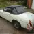 MGB ROADSTER 1966 WHITE WITH RED HIDE SEATS PIPED IN WHITE