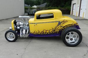 yellow 1932 blown coupe