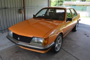 Holden VH Commodore HDT Papaya Dealer Pack in NT Photo