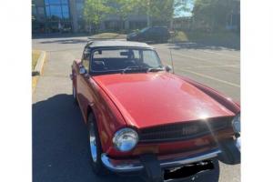 1974 Triumph TR6 74,000km comes with 2 tops, hard and soft.Comes with a rollbar. Photo