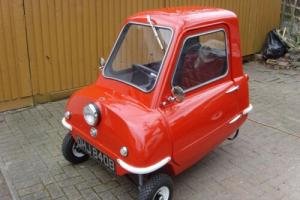 Peel P50 by P50 cars in signal red being newly registered on a cherished plate. Photo