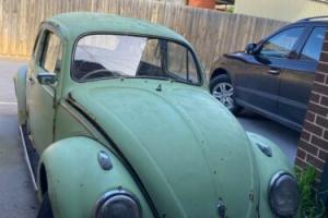 Old Rare green Herbie 1960’s Volkswagen Beetle with one original number plate Photo