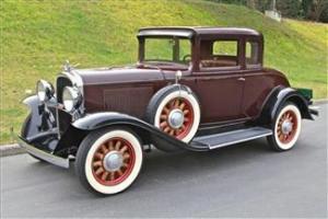 1931 Oldsmobile  Duel side mounts Coupe 