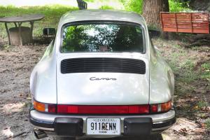 Silver 1987 911 Coupe that is upgraded with all the dream options and features