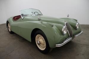 1954 Jaguar XK 120 Roadster, matching numbers, willow green w/ red interior Photo