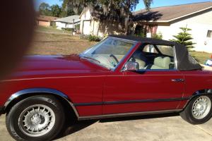 1978 Mercedes 450 SL Convertible Roadster / jump seat. Euro lights, maroon.