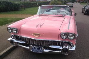  1958 CADILLAC CONVERTIBLE the only way to leave a building  Photo