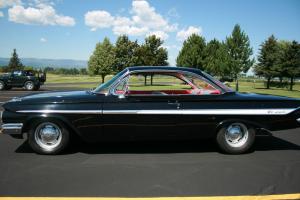 1961 Impala Bubbletop 409 motor with a 4 speed  black outside, red inside