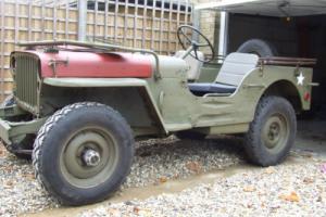 WILLYS JEEP WITH TUB THAT HAS SEEN SERIOUS WW2 ACTION Photo