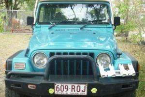 Jeep Wrangler Sport 4x4 1997 2D Softtop 5 SP Manual 4x4 4L in Macleay Island, QLD Photo