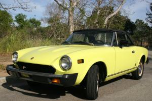PRISTINE VINTAGE YELLOW CONVERTIBLE FIAT124 SPIDER 1975 - A COLLECTOR'S ITEM!! Photo