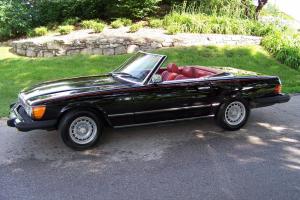 Classic car in great condition, black exterior/red interior, convertible, 2 tops Photo