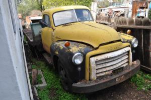 1953 GMC 2-ton flatbed truck with original plates. Yellow with clear title Photo
