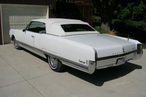 1965 Oldsmobile 98 convertible white with white top 78,500 2 owner miles Photo