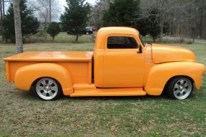 This is an orange 1955 Chevy, that needs a few more minor details put into it. Photo