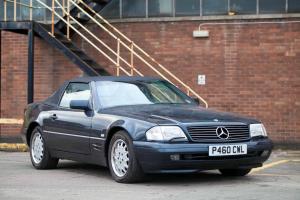 Low millage SL320 with hardtop.