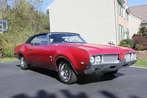 1969 Convertible, red with black top and interior, bucket seats with console Photo