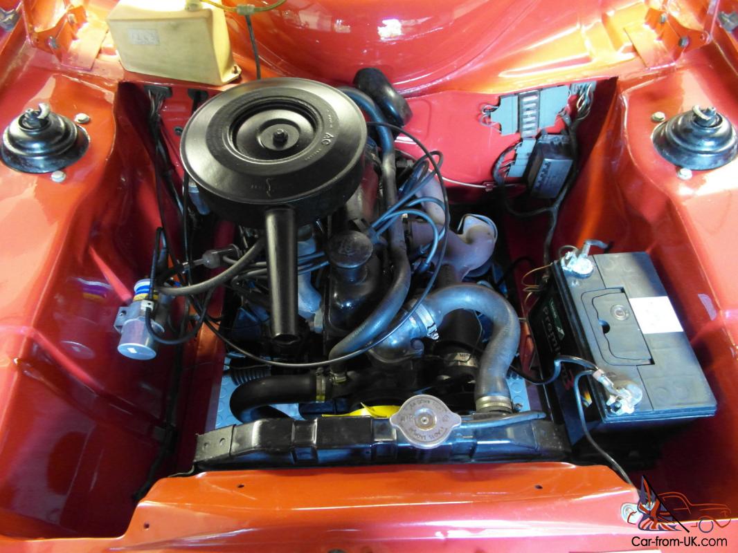 Where is the bonnet release catch on a ford escort