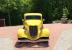 Yellow 1934 Ford 3 window coupe built by fiberfab, engine is Chevy 502ci.