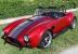 NEW 1965 BACKDRAFT ROADSTER FORD COYOTE T5 5 Speed CHRYSTAL RED  Gray Stripes