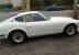 1973 Datsun 240 Z  color white. 2 door coup red interior