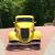 Yellow 1934 Ford 3 window coupe built by fiberfab, engine is Chevy 502ci.