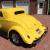 Yellow 1934 Ford 3 window coupe built by fiberfab, engine is Chevy 502ci.