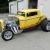 yellow 1932 blown coupe