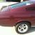 ford mustang fastback, deep maroon, automatic.