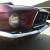 ford mustang fastback, deep maroon, automatic.