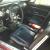 ford mustang fastback, deep maroon, automatic.