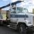 freightliner semi with flatbed and jiffy jib boom crane