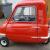 Peel P50 by P50 cars in signal red being newly registered on a cherished plate.