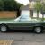 Mercedes Benz 450SL R109 1975 in two tone metallic green and black soft top