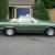 Mercedes Benz 450SL R107 1975 in two tone metallic green and black soft top