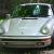 Silver 1987 911 Coupe that is upgraded with all the dream options and features