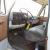 5 ton flatbed diesel truck, white single cab, bench seat, black 12' long