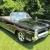 1964 Pontiac Bonneville triple black convertible with American Racing Wheels