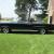 1964 Pontiac Bonneville triple black convertible with American Racing Wheels