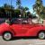 Morris Minor 1000 convertible 1964 signal red with black interior trim .