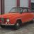 1966 Saab model 96 Standard - orange and black. Nice antique classic