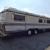 EXECUTIVE 1987 MOTORHOME LOW MILES GAS PUSHER TAG AXLE IN VERY NICE CONDITION !!
