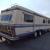 EXECUTIVE 1987 MOTORHOME LOW MILES GAS PUSHER TAG AXLE IN VERY NICE CONDITION !!