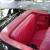Classic car in great condition, black exterior/red interior, convertible, 2 tops
