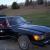 Classic car in great condition, black exterior/red interior, convertible, 2 tops